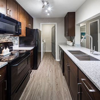 Kitchen with dark wood cabinetry